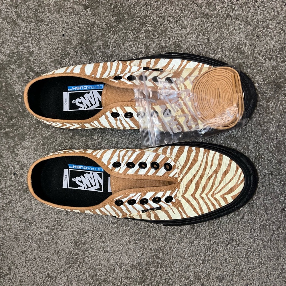 Brand new gold zebra Vans sneakers.